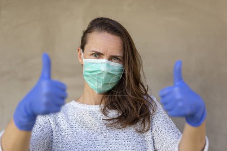 Photo for Portrait of woman wearing medical face protection mask; air pollution or allergies protection, coronavirus, bacterial and viral respiratory infections prevention concept - Royalty Free Image