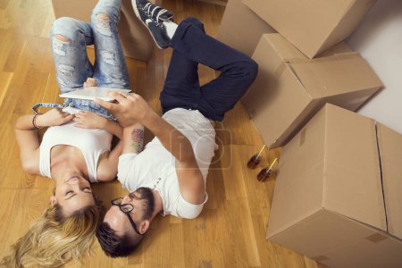 Photo for Young couple in love moving in a new flat - Royalty Free Image
