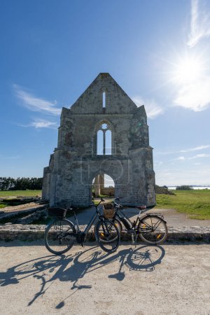 The ruin of the Xl century abbey des chateliers on the island of ile de re,france. bikes standing in front of the old batiment