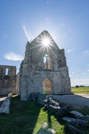 The ruin of the Xl century abbey des chateliers on the island of ile de re,france. sunlight streams through the building