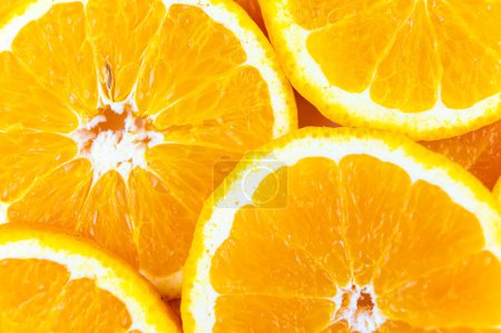Orange slices close together and on a white background. Orange pulp.