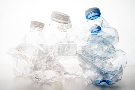 Photo for Plastic bottles, blue and transparent, crushed. Waste and plastic pollution, plastic recycling. - Royalty Free Image