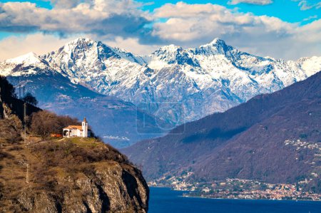 The Church of San Martino, on Lake Como, and the snow-capped mountains in the background.