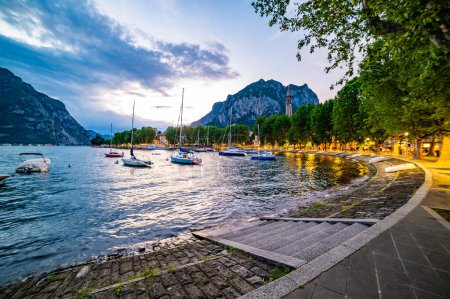The lakeside of Lecco, photographed at dusk.