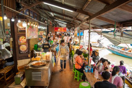 Photo for A Restaurant at the Market at the Floating Market at the Klong Chula of the Mae Klong River in the Town of Amphawa in the Province of Samut Songkhram in Thailand,  Thailand, Amphawa, November, 2022 - Royalty Free Image