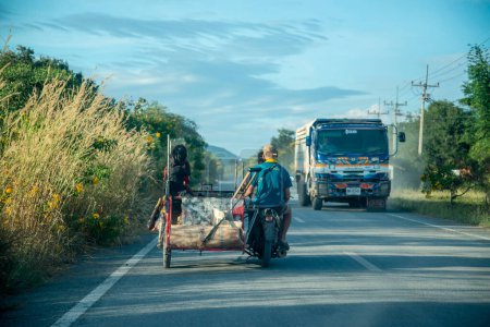 Photo for A Motobike on a road near the City of Lopburi in the Province of Lopburi in Thailand,  Thailand, Lopburi, November, 2022 - Royalty Free Image