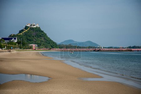 Photo for The Beach at the Beach road with the Wat Thammikaram Worawihan or Wat Khao Chong Krajok on the Hill in the City of Phrachuap Khiri Khan in the Province of Prachuap Khiri Khan in Thailand,  Thailand, Prachuap Khiri Khan, December, 2022 - Royalty Free Image