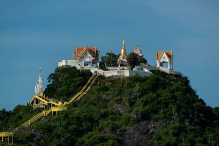 Photo for The Hill with the Wat Thammikaram Worawihan or Wat Khao Chong Krajok on the Hill in the City of Phrachuap Khiri Khan in the Province of Prachuap Khiri Khan in Thailand,  Thailand, Prachuap Khiri Khan, December, 2022 - Royalty Free Image