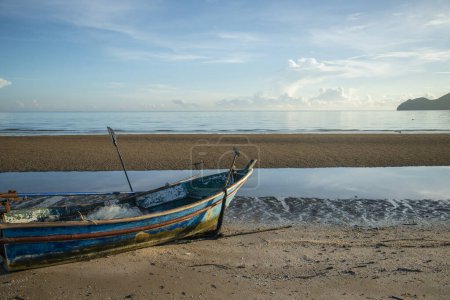 Photo for A fishingboat in the morning with the Landscape of the Beach and Coast at Dolphin Bay at the Hat Sam Roi Yot in the Province of Prachuap Khiri Khan in Thailand,  Thailand, Hua Hin, December, 2022 - Royalty Free Image
