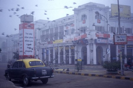 Photo for The shopping area of Connaught Place in the city of New Delhi in India.  India, Delhi, Februar, 1998 - Royalty Free Image