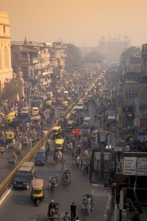 Photo for A air pollution with traffic on a long road in the city of Old Delhi in India.  India, Delhi, February, 1998 - Royalty Free Image