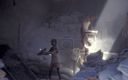 Photo for A stone and sand factory in a fabric house at a village of a slum in the city centre of Mumbai in India.  India, Mumbai, March, 1998 - Royalty Free Image