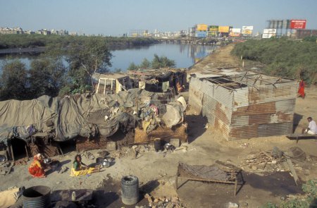 Photo for A village centre of a slum in the city centre of Mumbai in India.  India, Mumbai, March, 1998 - Royalty Free Image