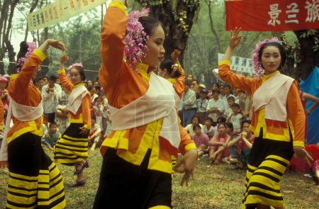 Photo for A traditional dance at the spring and water festival near the town of Jinghong in Xishuangbanna in the region of the province of Yunnan in China in east asia.  China, Yunnan, April, 1996 - Royalty Free Image