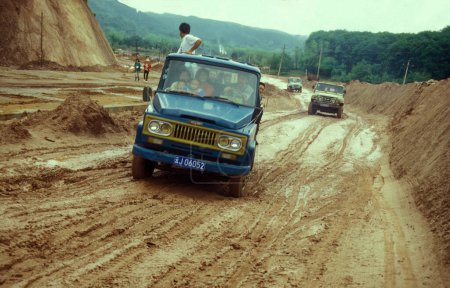 Photo for A bad mud road near the town of Jinghong in Xishuangbanna in the region of the province of Yunnan in China in east asia.  China, Yunnan, April, 1996 - Royalty Free Image