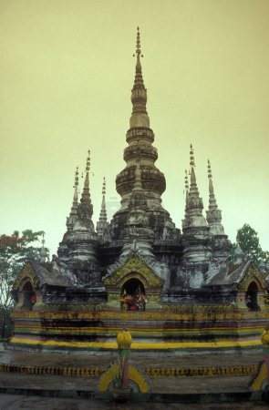 Photo for The Manfeilong Pagoda in the town of Jinghong in Xishuangbanna in the region of the province of Yunnan in China in east asia.  China, Yunnan, April, 1996 - Royalty Free Image
