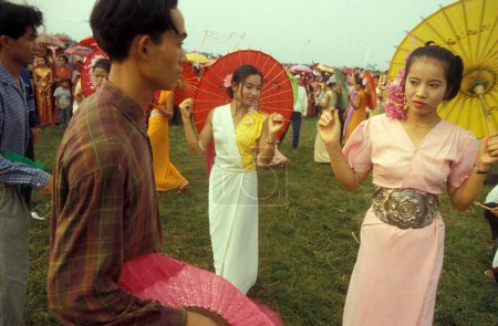 Photo for A traditional dance at the spring and water festival near the town of Jinghong in Xishuangbanna in the region of the province of Yunnan in China in east asia.  China, Yunnan, April, 1996 - Royalty Free Image