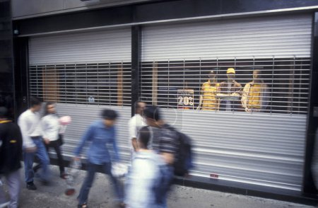 Photo for People in a shopping street in the old town in Kowloon in the city of Hongkong in Hongkong.  China, Hongkong, December, 1997 - Royalty Free Image