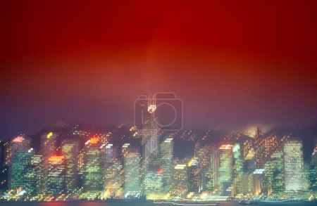 Photo for A view on the Victoria harbour in front of the Skyline of Central Hongkong from the viewpoint of Kowloon in the city of Hongkong in Hongkong.  China, Hongkong, May, 1999 - Royalty Free Image