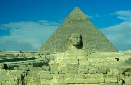 Photo for The monument of Sphinx in front of pyramids of giza near the city of Cairo at the capital of Egypt in north africa.  Egypt, Cairo, March, 2000 - Royalty Free Image