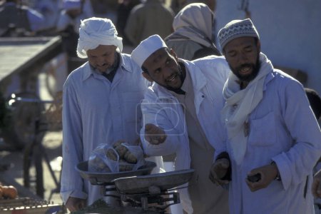 Photo for People at the Food Market in the old Village of Siwa in the Libyan or estern Desert of Egypt in North Africa.  Egypt, Siwa, March, 2000 - Royalty Free Image