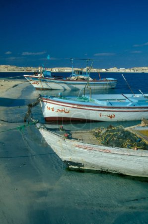 Photo for A Fishingboat at the Fishing Harbour in the Town of Marsa Matruh on the Mediterranean Sea in Egypt in North Africa.  Egypt, Alexandria, march, 2000 - Royalty Free Image