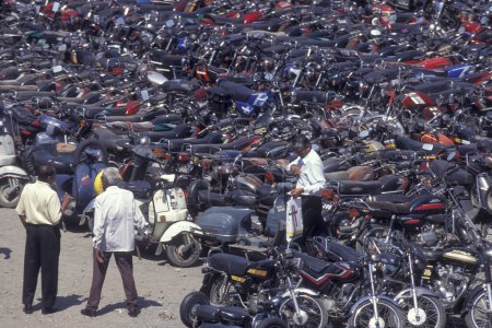 Photo for A Motorbike Parking in the city of Surat in the Province Gujarat in India.  India, Gujarat, April, 1998 - Royalty Free Image
