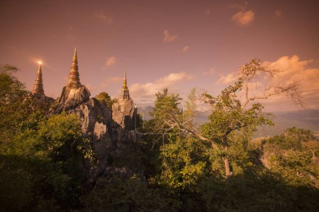 Photo for The Wat Phra Bat Phu Pha Daeng or Wat Chalermprakiet Prajomklao Rachanusorn Temple North of the City of Lampang in the Province of Lampang in North Thailand.  Thailand, Lampang, November, 2016 - Royalty Free Image