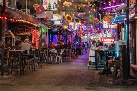 Photo for The Walkingstreet and Barstreet, Soi Bintabaht at nightlife in the old town in the City of Hua Hin in the Province of Prachuap Khiri Khan in Thailand,  Thailand, Hua Hin, December, 2023 - Royalty Free Image