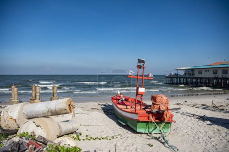Photo for A beach with fishingboats in front of a traditional woodhouse and Restaurant at the coast in the old town in the City of Hua Hin in the Province of Prachuap Khiri Khan in Thailand,  Thailand, Hua Hin, December, 2023 - Royalty Free Image