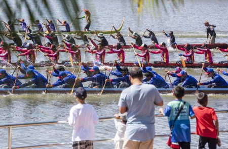 Photo for Dragonboat or Longboat teams on the Lake Khao Tao at the Longboat race of Hua Hin on the Lake Khao Tao reservoir south of City of Hua Hin.  Thailand, Hua Hin, December, 2023 - Royalty Free Image