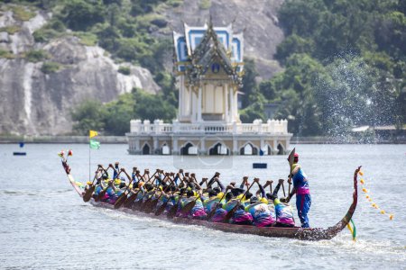 Photo for A Dragonboat or Longboat Team in front of the Royal pavillon on the Lake Khao Tao at the Longboat race of Hua Hin on the Lake Khao Tao reservoir south of City of Hua Hin.  Thailand, Hua Hin, December, 2023 - Royalty Free Image