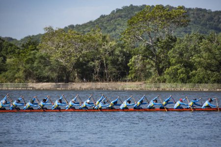 Photo for Dragonboat or Longboat teams on the Lake Khao Tao at the Longboat race of Hua Hin on the Lake Khao Tao reservoir south of City of Hua Hin.  Thailand, Hua Hin, December, 2023 - Royalty Free Image