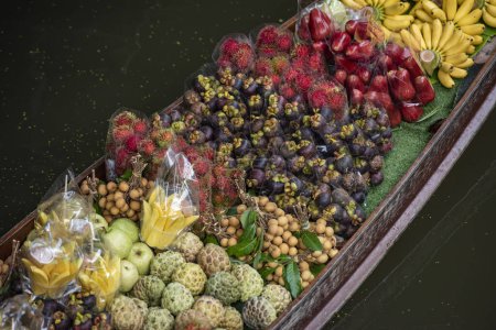 Photo for A Woodboat with lots of fresh Thai Fruits at Damnoen Saduak Floating market in Province of Ratchaburi in Thailand,  Thailand, Ratchaburi, 12, November, 2023 - Royalty Free Image