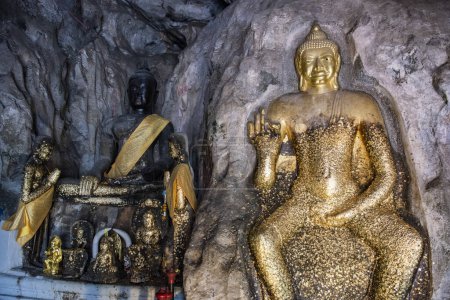 The Phra Phuttha Chai Buddha sculpture at the Tham Ruesi Khao Ngu cave a the Tham Khao Ngu in the Province of Ratchaburi in Thailand,  Thailand, Ratchaburi, November, 15, 2023