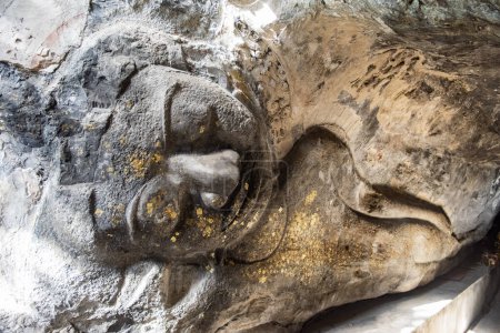 Photo for A stone carving reclining Buddha figure in the Fa Tho Cave at Tham Khao Ngu in the Province of Ratchaburi in Thailand,  Thailand, Ratchaburi, November, 15, 2023 - Royalty Free Image