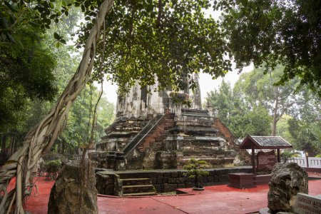 the old stupa at new Temple of Wat Mahathat Worawihan in the city and Province of Ratchaburi in Thailand,  Thailand, Ratchaburi, November, 14, 2023
