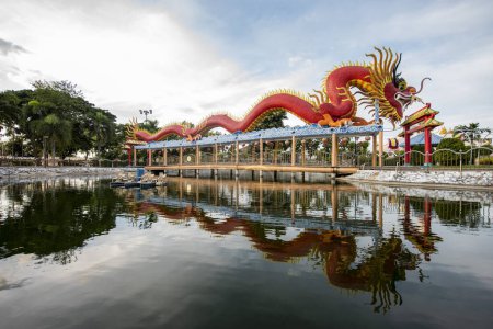 Photo for Ganesha shrine Park with a large Dragon in city centre of Mueang Chonburi City in Province of Chonburi in Thailand.  Thailand, Chonburi, October, 31, 2023 - Royalty Free Image