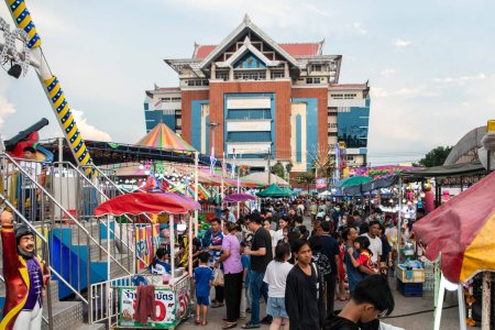 Photo for People enjoy the large Fair with Food stalls and large Market at Buffalo Race Festival or Wing Khwai in Mueang Chonburi City and Province in Thailand.  Thailand, Chonburi, October, 28, 2023 - Royalty Free Image
