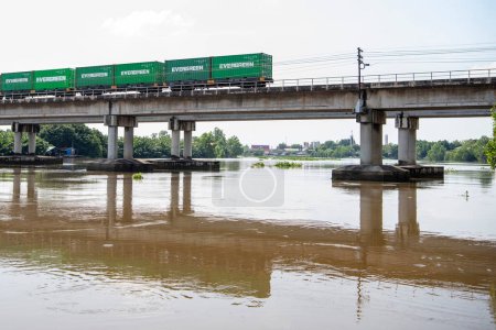 Photo for Railway Bridge over Khlong Prawet Burirom River near city Mueang Chachoengsao City in Province of Chachoengsao in Thailand.  Thailand, Chachoengsao, November, 5, 2023 - Royalty Free Image