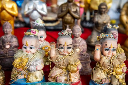 Photo for Buddha figures at a market in the city centre of Udon Ratchathani and Province Ubon Ratchathani in Thailand.  Thailand, Ubon Ratchathani, November, 25, 2023 - Royalty Free Image