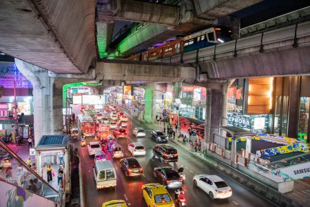 Photo for Traffic with cars on the road at the Siam Square in the city of Bangkok in Thailand.  Thailand, Bangkok, December, 7, 2023 - Royalty Free Image
