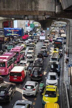 Photo for Traffic with cars on the road at the Siam Square in the city of Bangkok in Thailand.  Thailand, Bangkok, December, 8, 2023 - Royalty Free Image