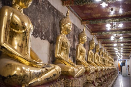 Photo for Buddha statues at Wat Suthat Thepwararam Ratchaworamahawihan in Banglamphu in the city of Bangkok in Thailand.  Thailand, Bangkok, December, 9, 2023 - Royalty Free Image