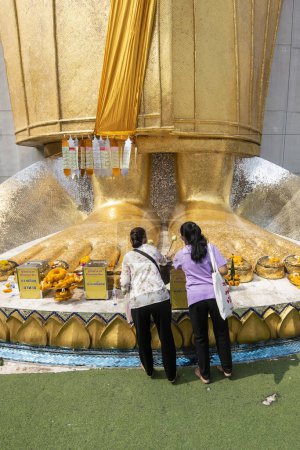 Photo for The Buddha Feet of the Golden Buddha of Wat Intharawihan in Thewet in the city of Bangkok in Thailand.  Thailand, Bangkok, December, 9, 2023 - Royalty Free Image
