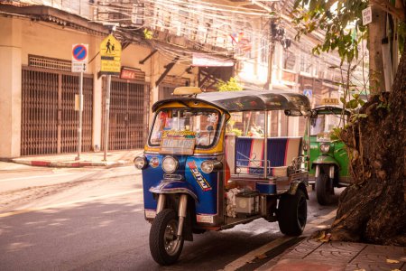 Photo for A Tuktuk in a alley near the Yaowarat Road in China Town in the city of Bangkok in Thailand.  Thailand, Bangkok, November, 8, 2023 - Royalty Free Image