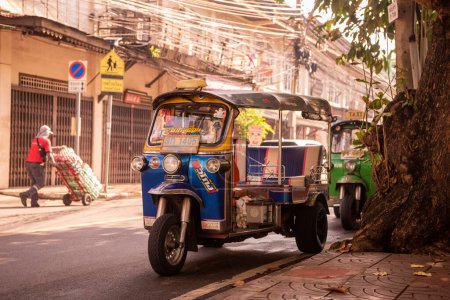 Photo for A Tuktuk in a alley near the Yaowarat Road in China Town in the city of Bangkok in Thailand.  Thailand, Bangkok, November, 8, 2023 - Royalty Free Image