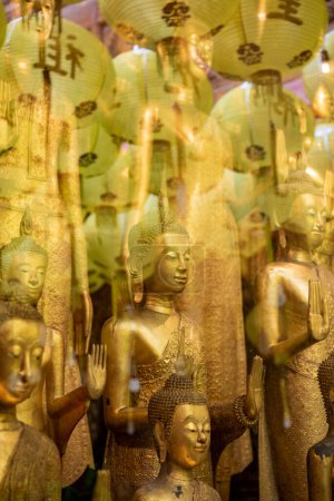 Photo for Buddha figures at Wat Mangkon Kamalawat or Wat Leng Noei Yi in China Town in the city of Bangkok in Thailand.  Thailand, Bangkok, November, 8, 2023 - Royalty Free Image