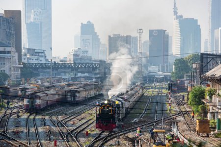 Photo for A old Steam locomotive on the route from Old Hua Lamphong Railway Station in China Town to Chachoengsao in the city of Bangkok in Thailand.  Thailand, Bangkok, December, 5, 2023 - Royalty Free Image