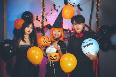 Photo for Halloween party in a bar at friend group. People group do costume fancy sexy, dance, alcohol, drink, happy, smile, on the special holiday of Halloween. Halloween celebration activities. - Royalty Free Image